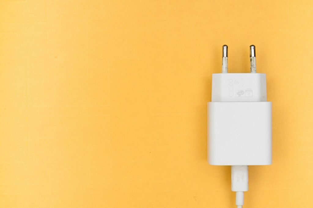 White adapter on yellow wall